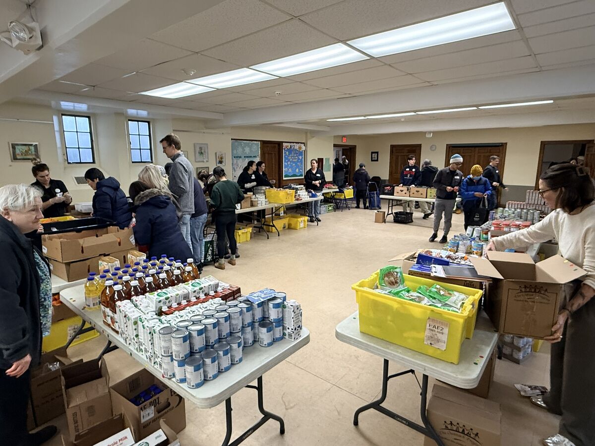Tables of groceries and essentials ready for neighbors on a pantry day